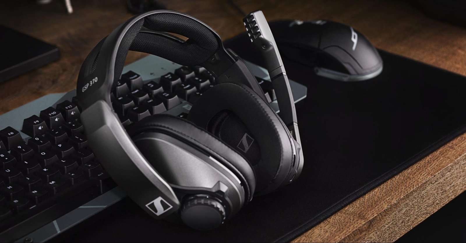 Sennheiser headphones with keyboard, mouse, and desk mat